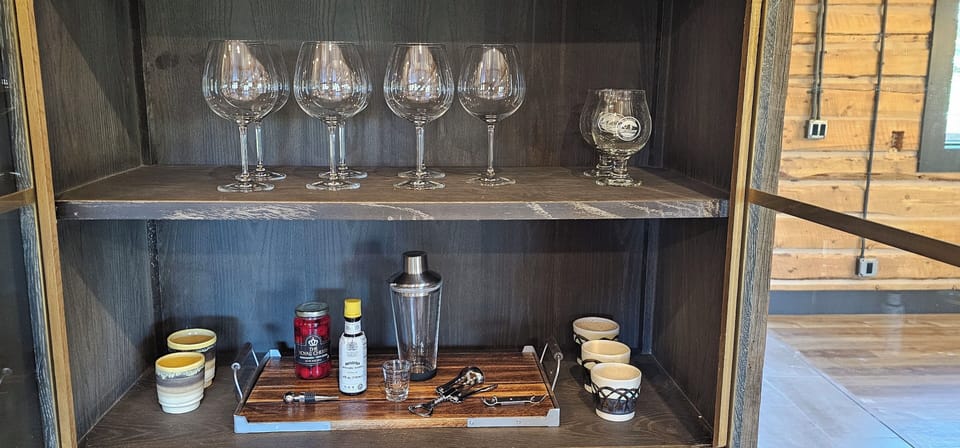Bar cabinet includes Wine glasses, beer glasses, wine opener, cocktail shaker