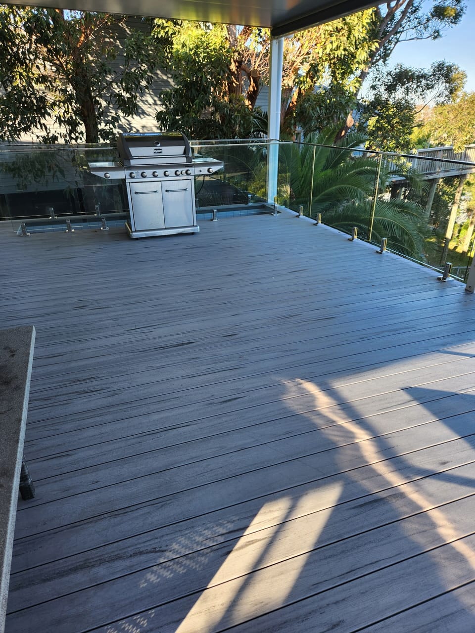 Stairs behind bbq to access bottom floor 