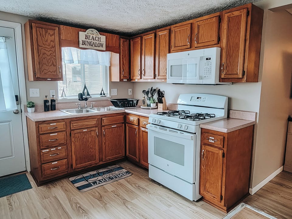 Make a meal in this fully equipped kitchen with basic spices, oil, pam, baggies.