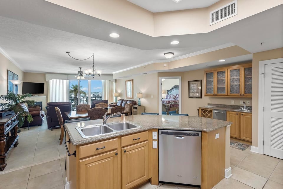 Kitchen - The open kitchen features a dishwasher, double sink and ample counter space for meal prep.