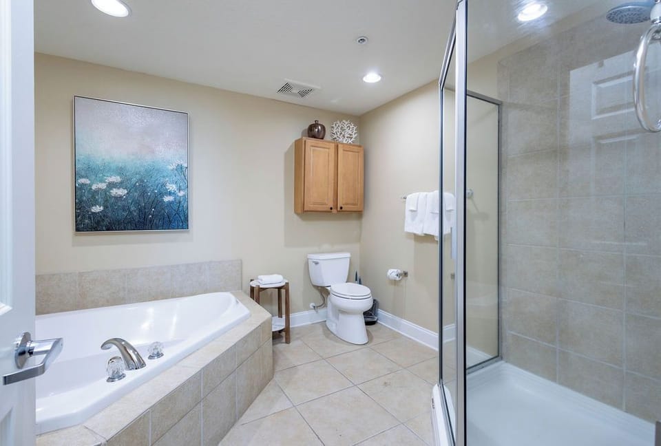 Primary Suite features a large soaking tub and separate shower