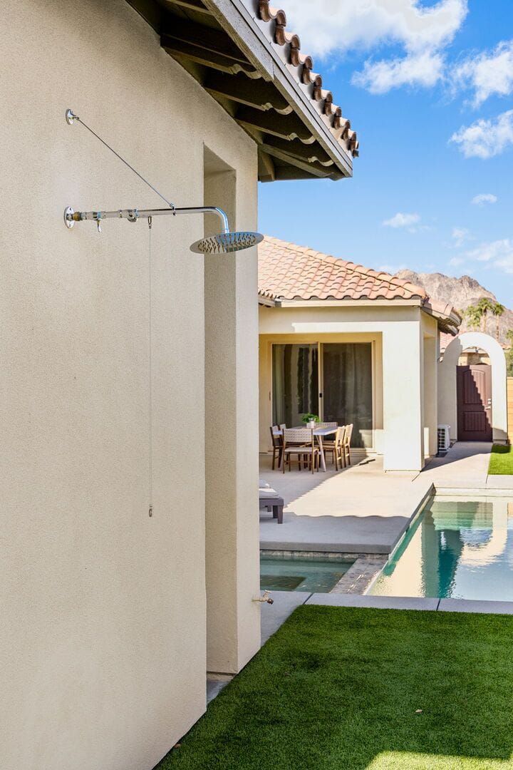 Outdoor shower to clean up before heading into the pool.