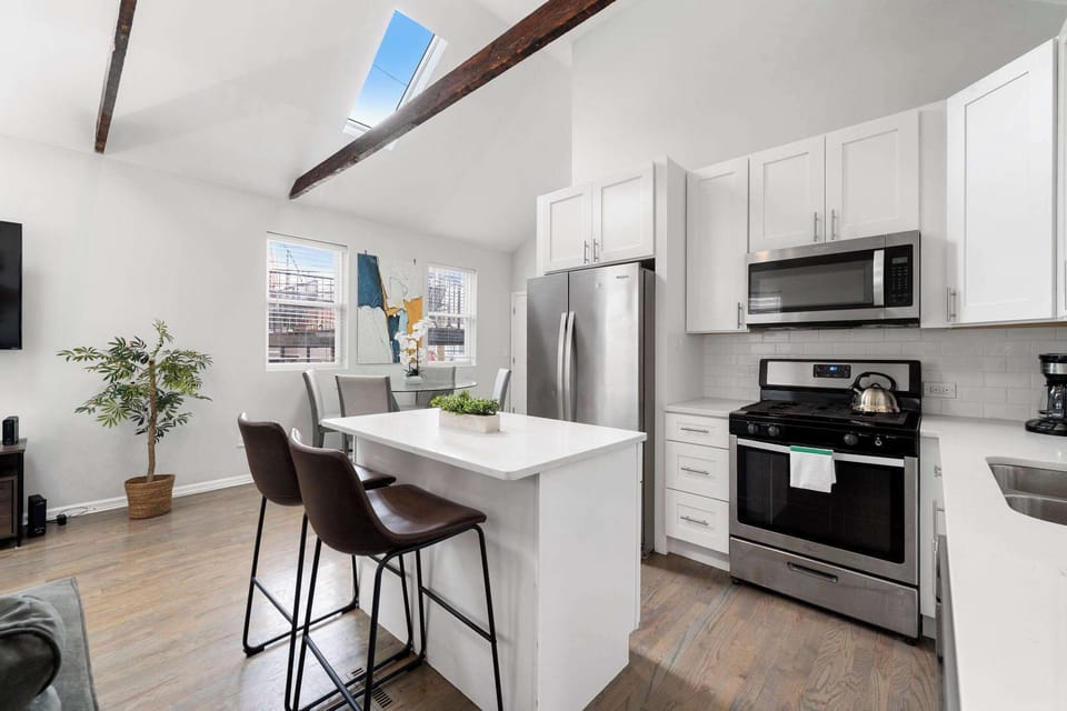 Airy open-concept space that keeps everyone connected while relaxing or dining.