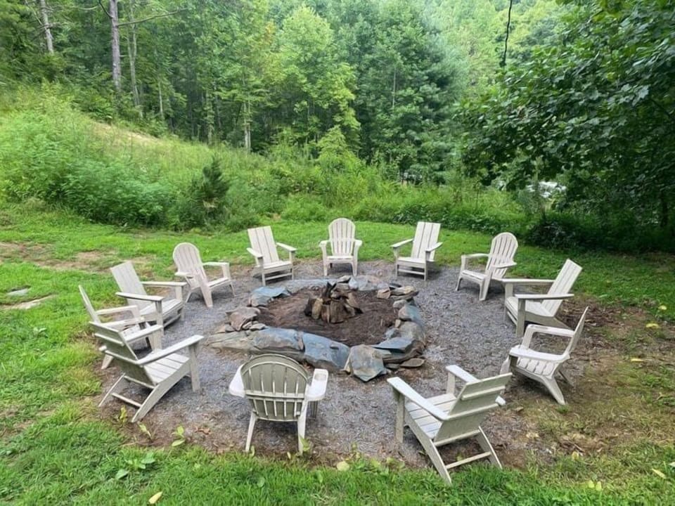 Outdoor Fire Pit Area Ideal for Evening Marshmallow Roasts Under the Stars - The Regal - Sevierville, TN