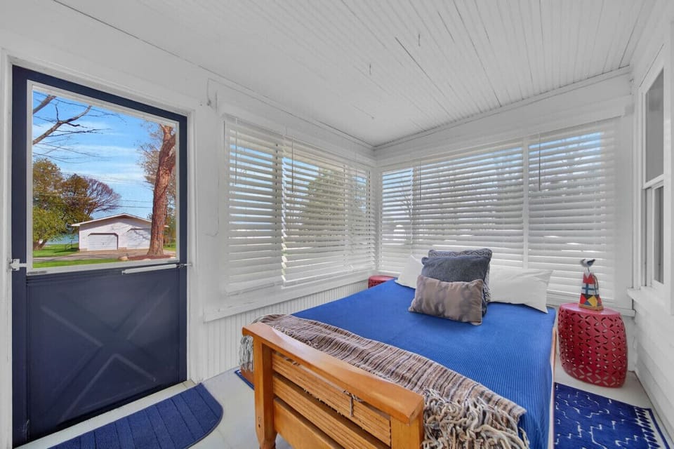 Three season room with a full size bed for more sleeping arrangements