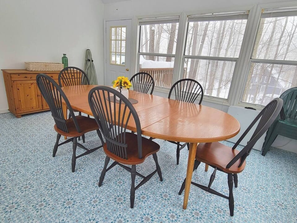 Dining table in the sunroom with seating