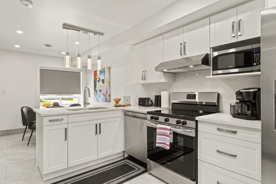 Pendant lights above the island create a sculptural focal point.