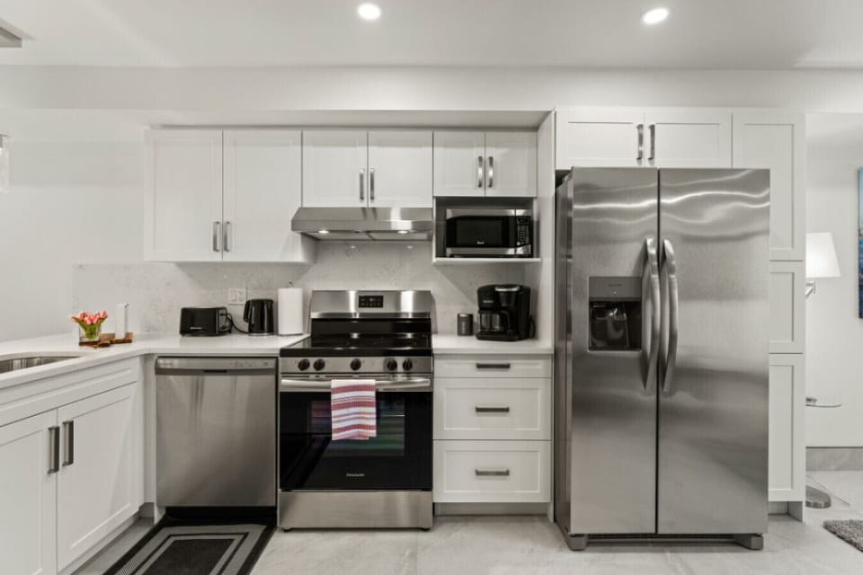 Stainless steel appliances complement contemporary design.