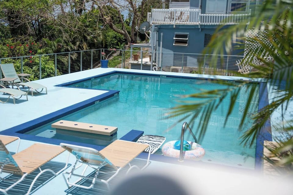 Spacious pool offers lounging chairs and incredible views on St. Thomas harbor, downtown and surrounding islands.