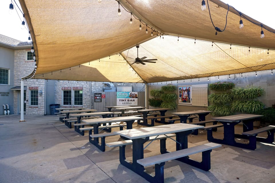 Covered, outdoor seating by the Tiki Bar for a quick picnic.