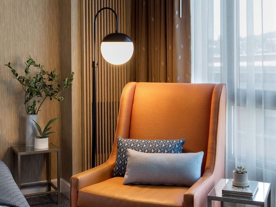 A tranquil corner with a leather armchair, creating the perfect spot for leisure reading or a peaceful respite.