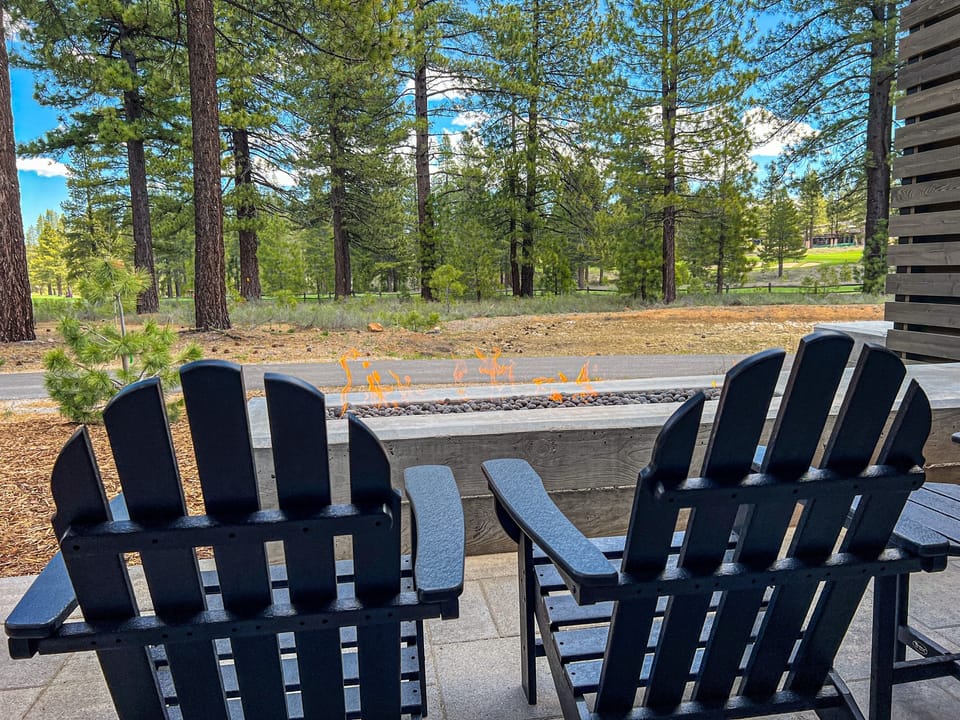 Enjoy golf course views from the 4 adirondack chairs around the gas fireplace or patio table with seating for 6 people
