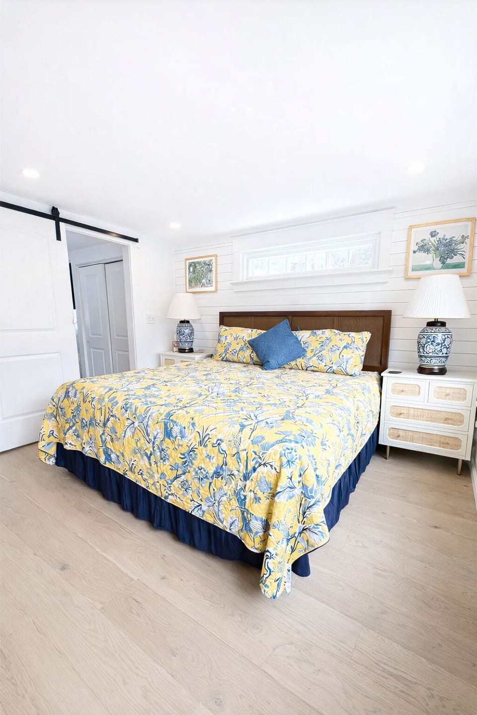 Primary bedroom with a king size bed and ensuite bathroom.