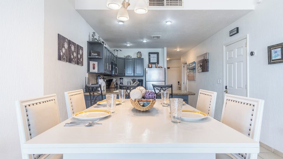 The raised dining table seats four guests.