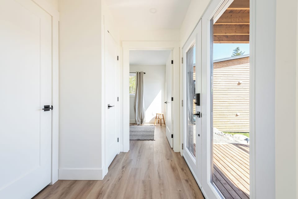 You enter on the lower level, which also has one bedroom and one bathroom.