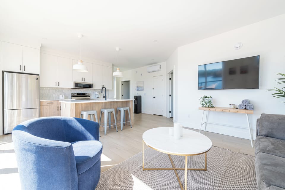 The open-concept living area on the upper level.