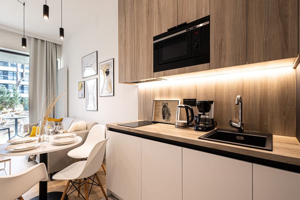 dining table with fully equipped kitchen