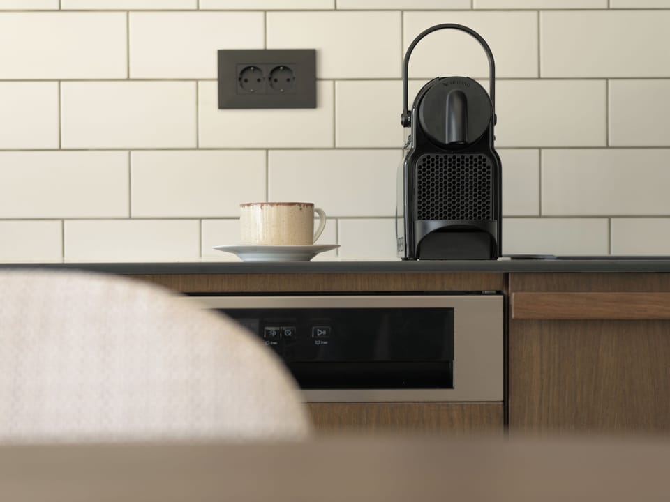 A Nespresso Machine (original capsules), is available.
