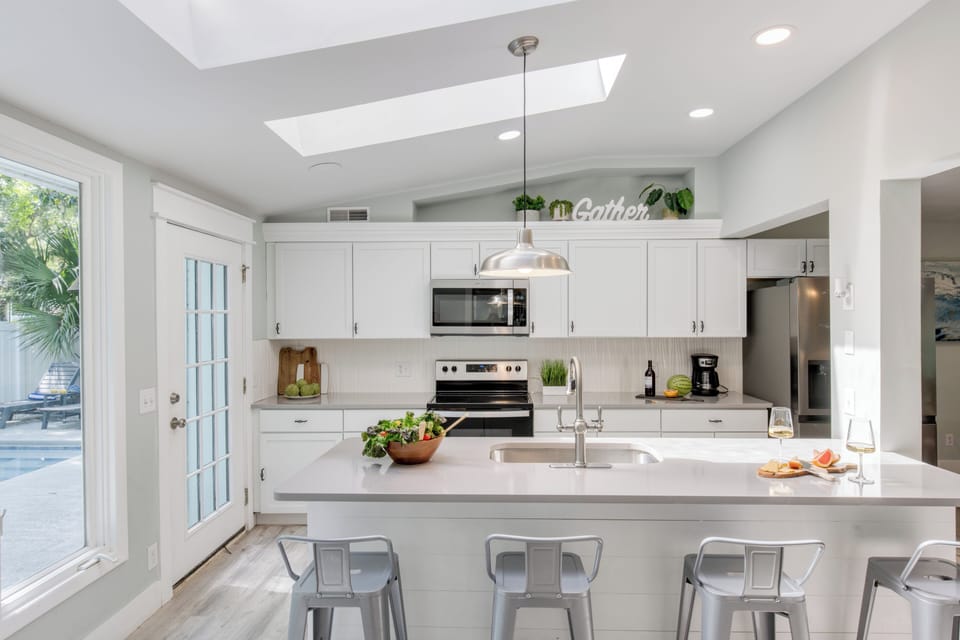 Island with barstool seating for casual meals.