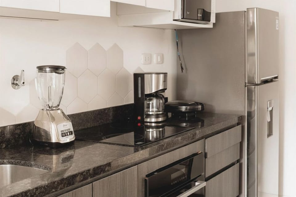 Modern kitchen countertop with blender and appliances