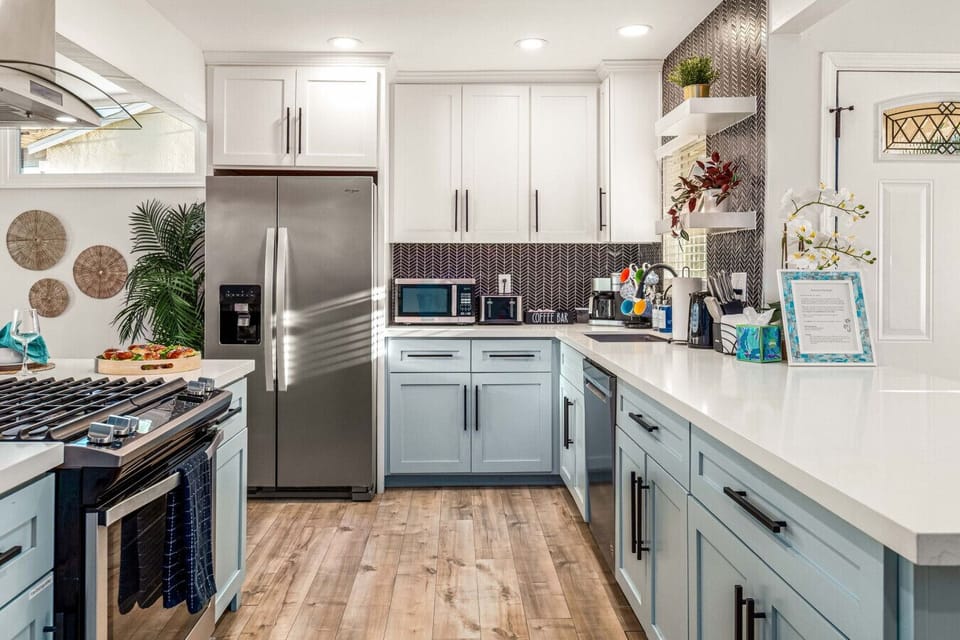 Fully stocked kitchen with modern charm and space to cook.