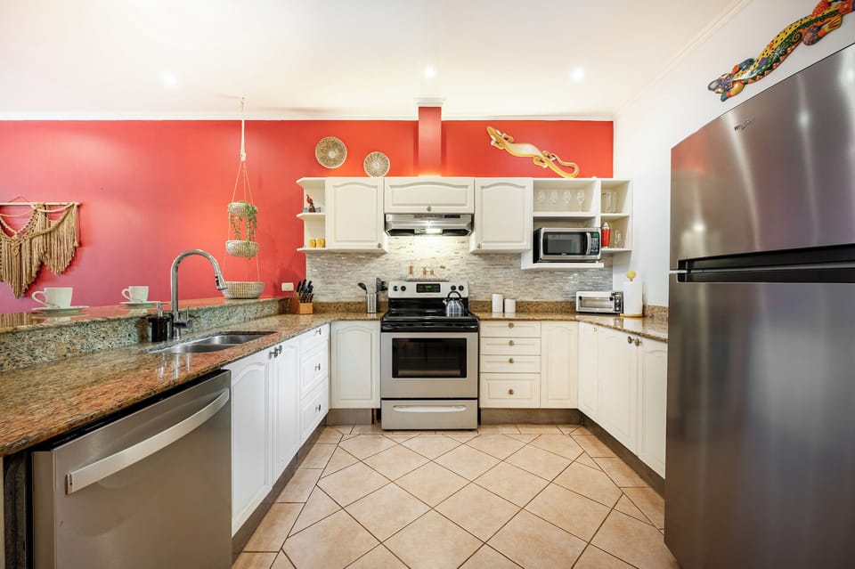 Kitchen is equipped with all the appliances you'd need to make home cooked meals