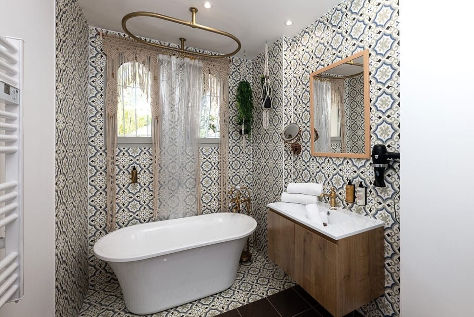 Bathroom with a bathtub and shower combination 