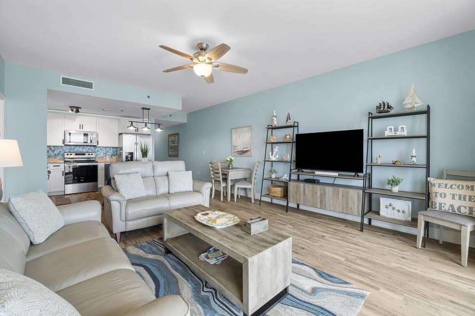 Open-concept living area with modern furnishings and a fully equipped kitchen.