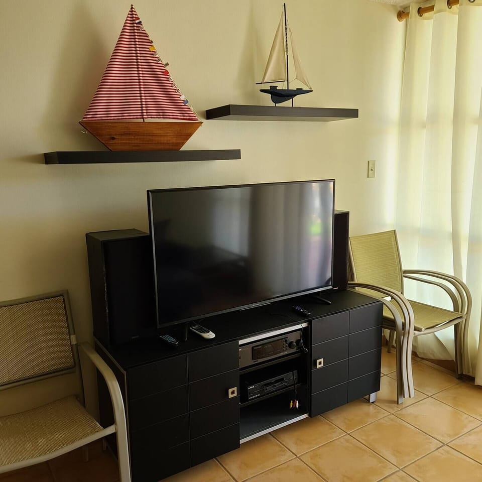 The sitting room offers comfortable seating and a Smart TV