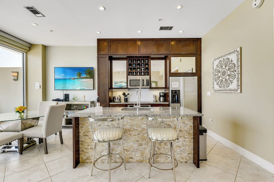 Fully-equipped kitchen with refrigerator, microwave, Keurig, coffee pot, dishwasher, garbage disposal.  Indoor dining!  75-inch LG Smart TV!