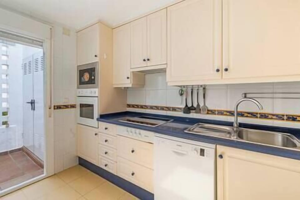 The kitchen is fully equipped with a table and chairs and all the utensils you would need. (2)