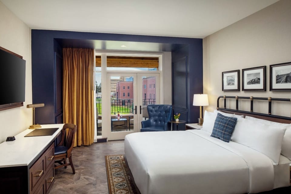 Relax in a cozy bedroom with views and reading chair.