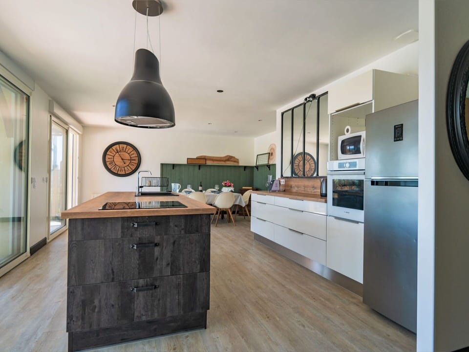 Cabinetry, Countertop, Kitchen, Drawer, Lighting, Wood, Interior Design, Flooring, Floor, Building