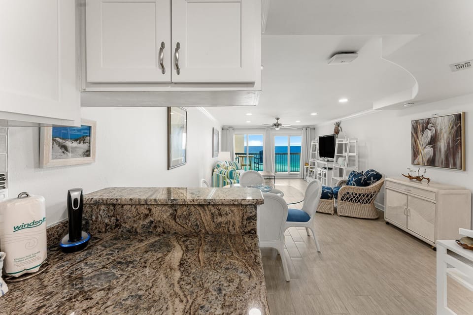 Kitchen is open to the dining/living room. You can serve appetizers on the extended counter.