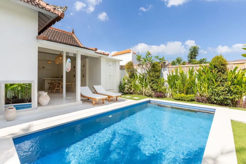 get some tan by the poolside in the sun lounger