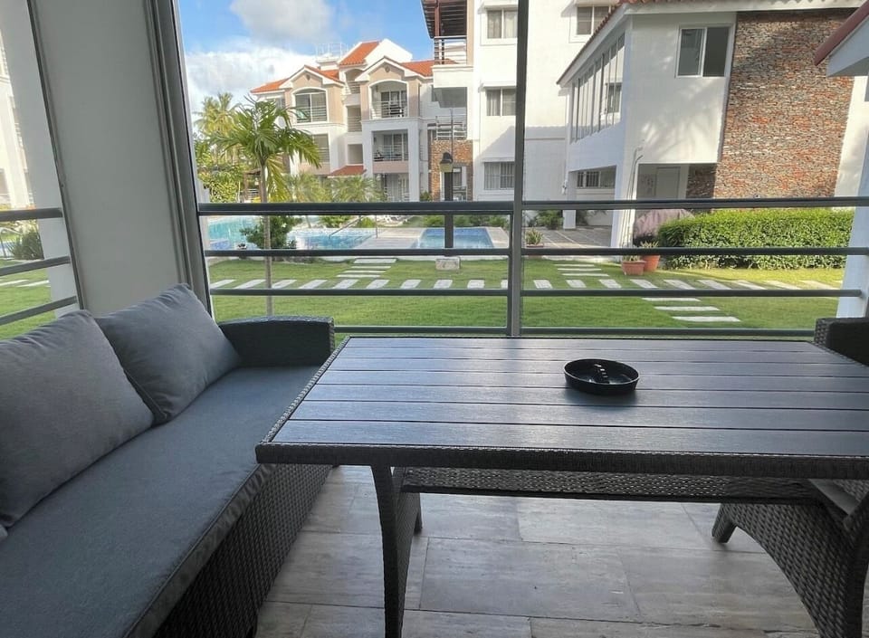 Outdoor porch area with screens for your comfort. 