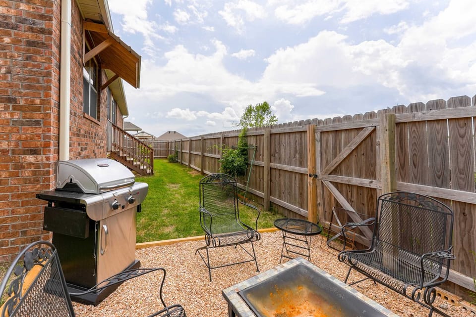 Roast marshmallows and stargaze around the backyard fire pit with seating for four.