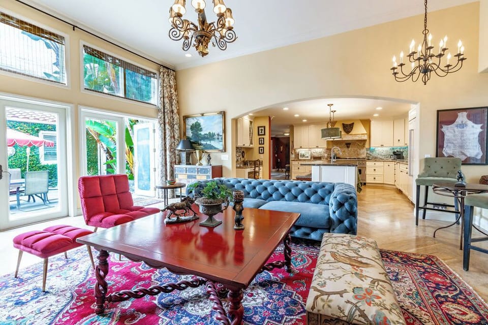 Relax in our family room while seamlessly extending into the outdoor area through our glass French doors, allowing you to experience a harmonious blend of indoor and outdoor spaces. This creates an open and inviting atmosphere, perfect for quality time with family and friends.