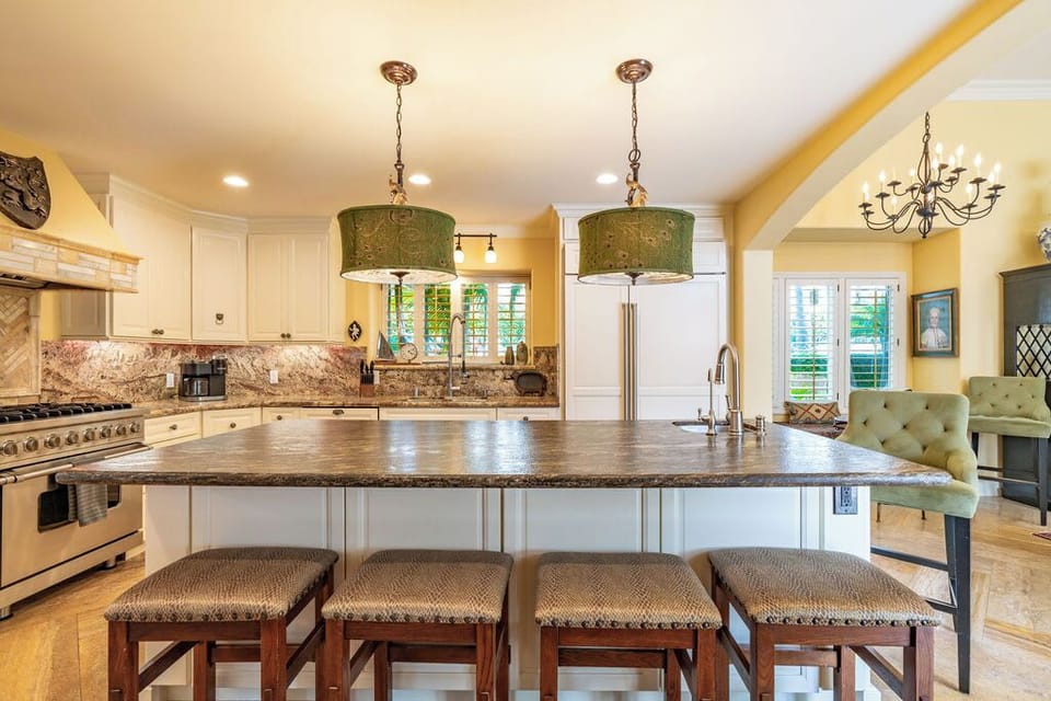 Enjoy the convenience of a generous island featuring barstool seating, perfect for casual dining or gathering around while preparing meals.