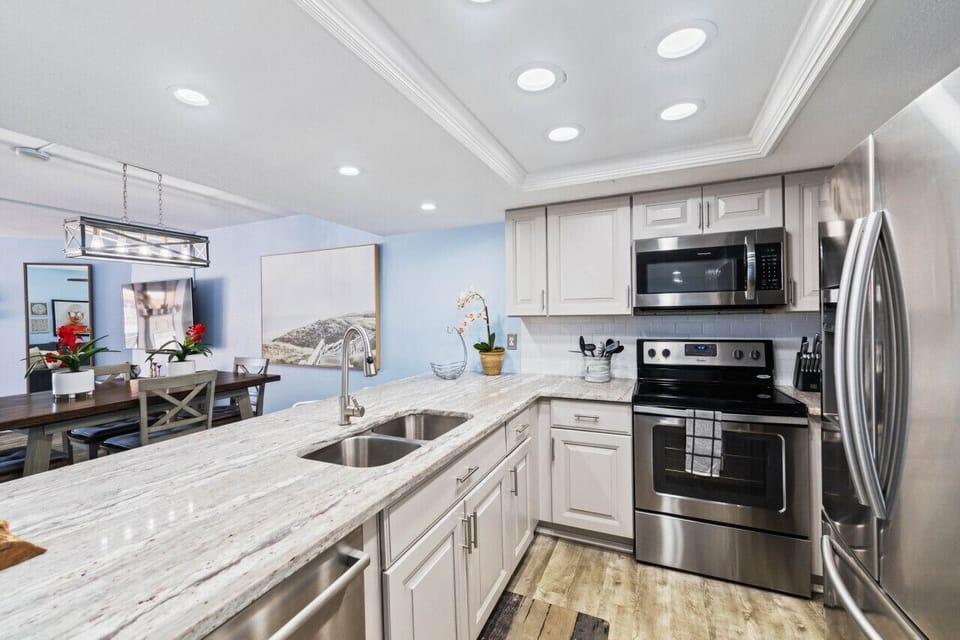 Fully equipped kitchen w/ stainless appliances, generous counter space, and room to cook with ease.