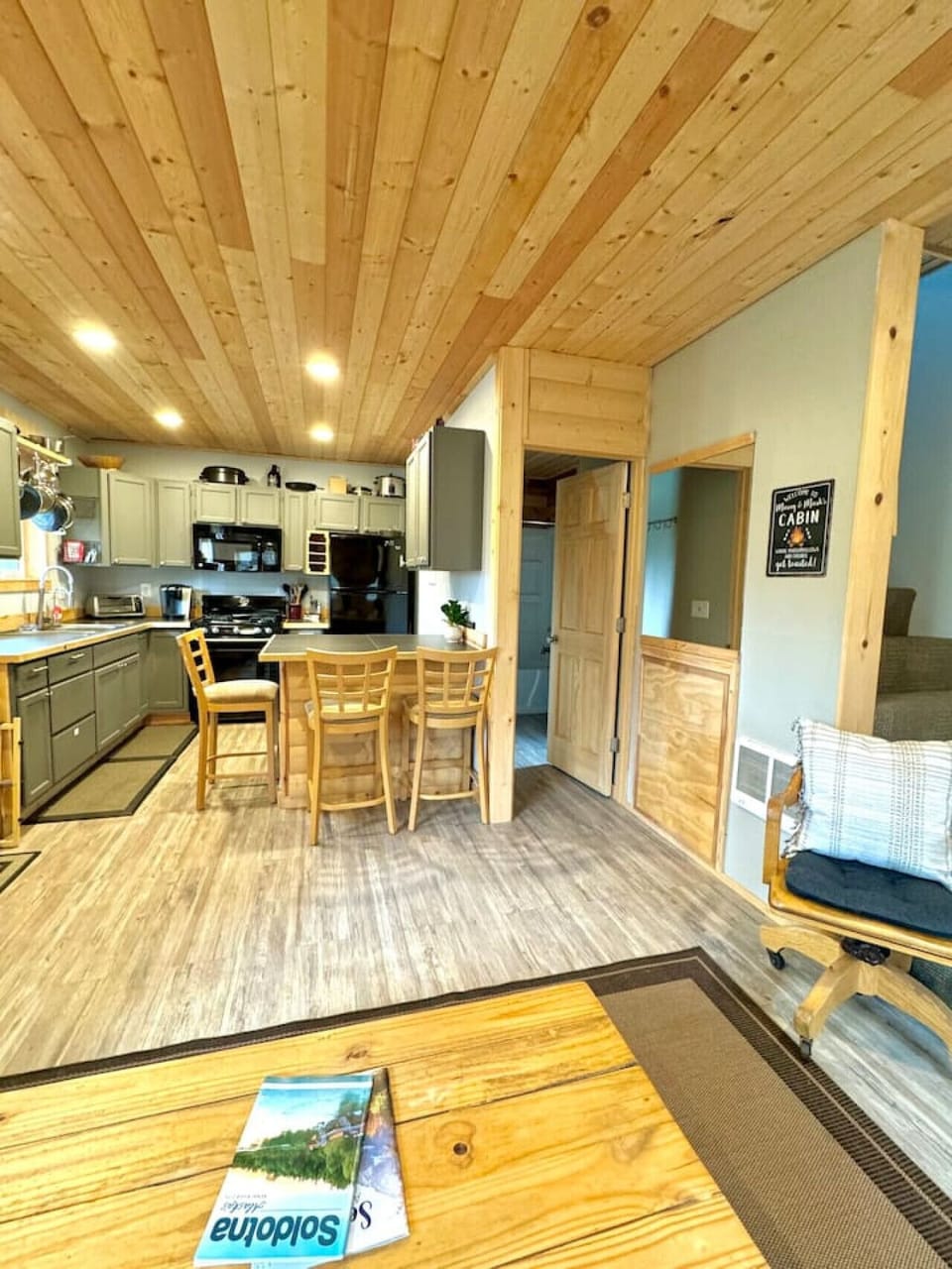 Photo shows kitchen & entrance to bathroom.