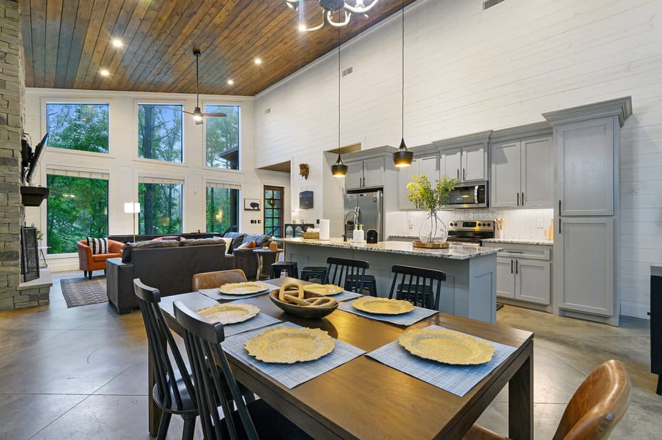 The dining area with the kitchen in the background.