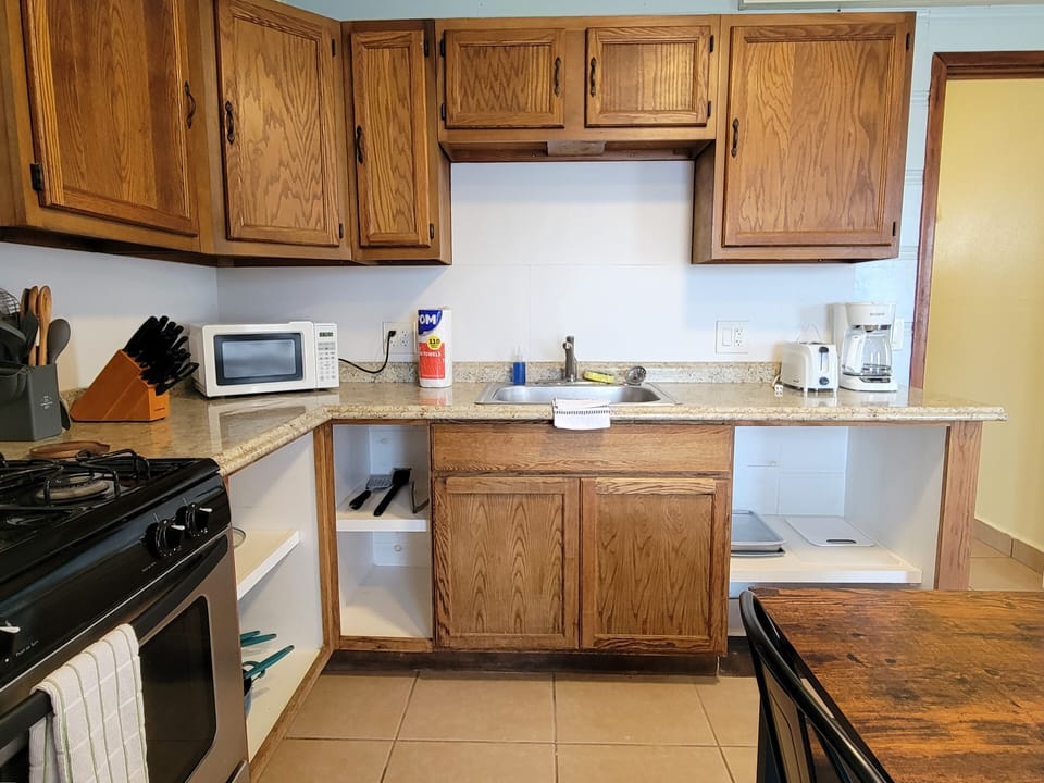 The kitchen has plenty of storage for your stay