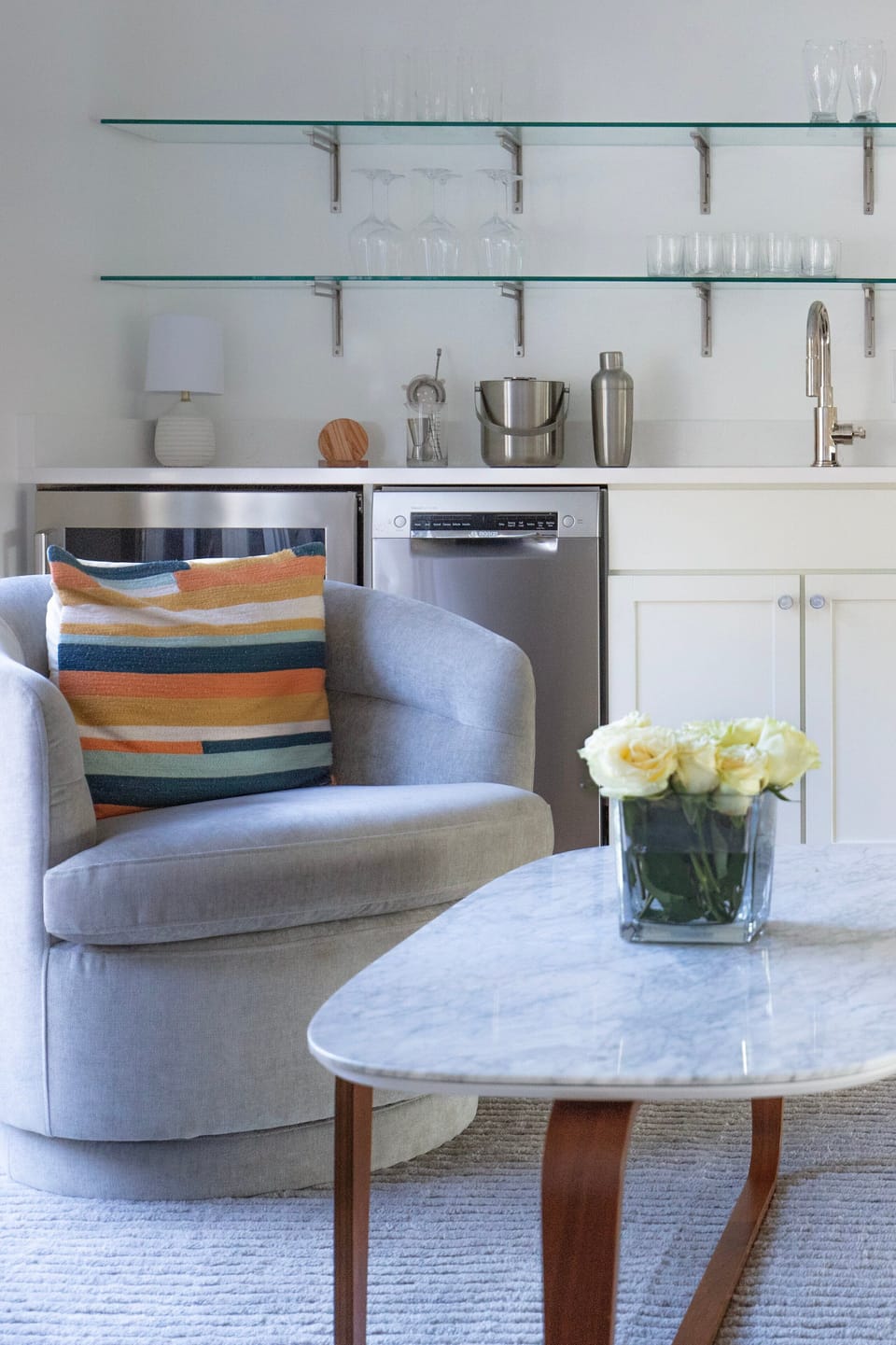 As you ascend to the mezzanine, a cozy mini lounge with wet bar awaits, offering a quiet nook for relaxation.