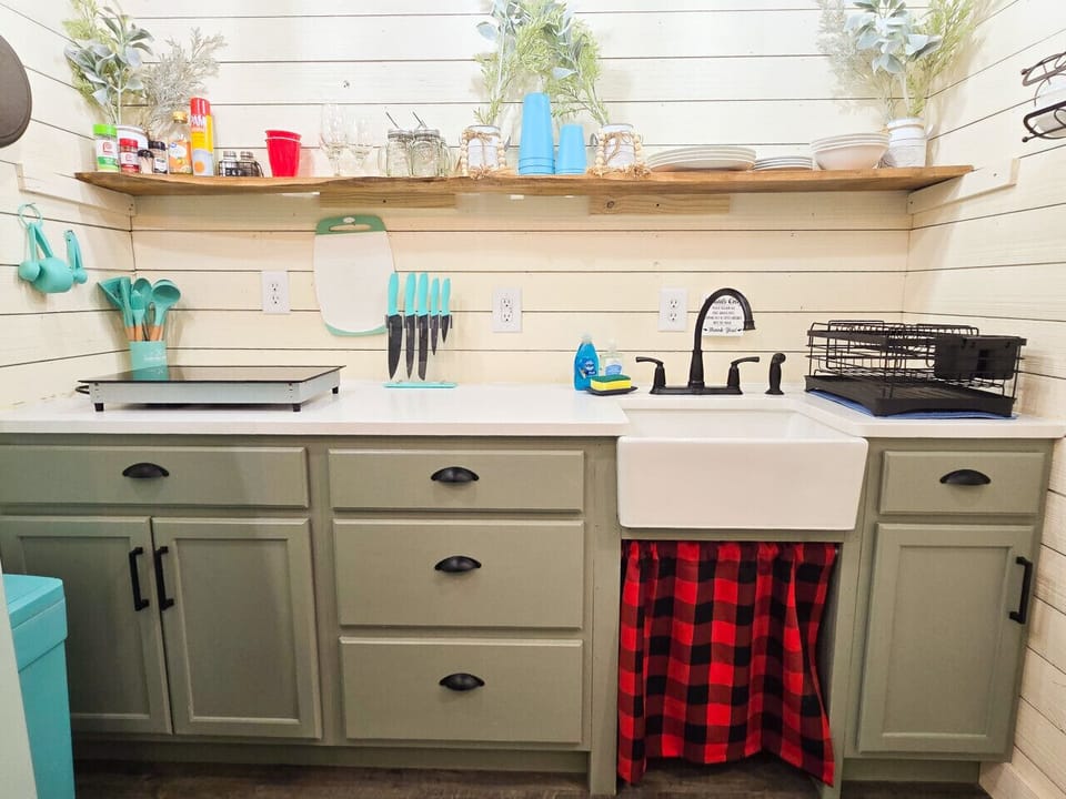 Surprisingly stocked kitchen with everything you need for tiny-home cooking.