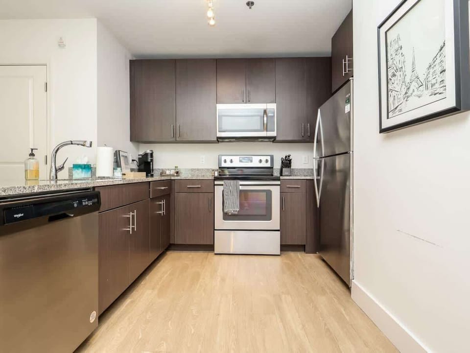 A centered view of the kitchen workspace highlighting the smooth transitions and integrated appliance layout.