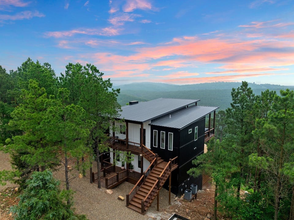 IN HIGH SPIRITS, part of Great Escapes Homes, is a luxury mountaintop retreat in Broken Bow