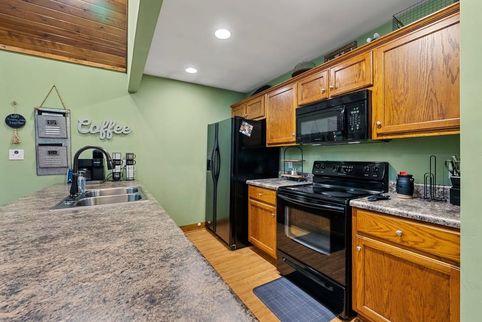 Well appointed kitchen with stove/oven, refrigerator/freezer, and dishwasher