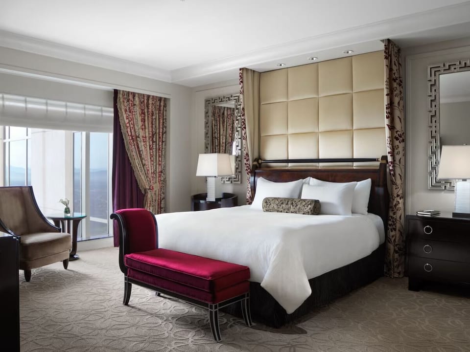 Settle into a serene king bed with soft, warm lighting.