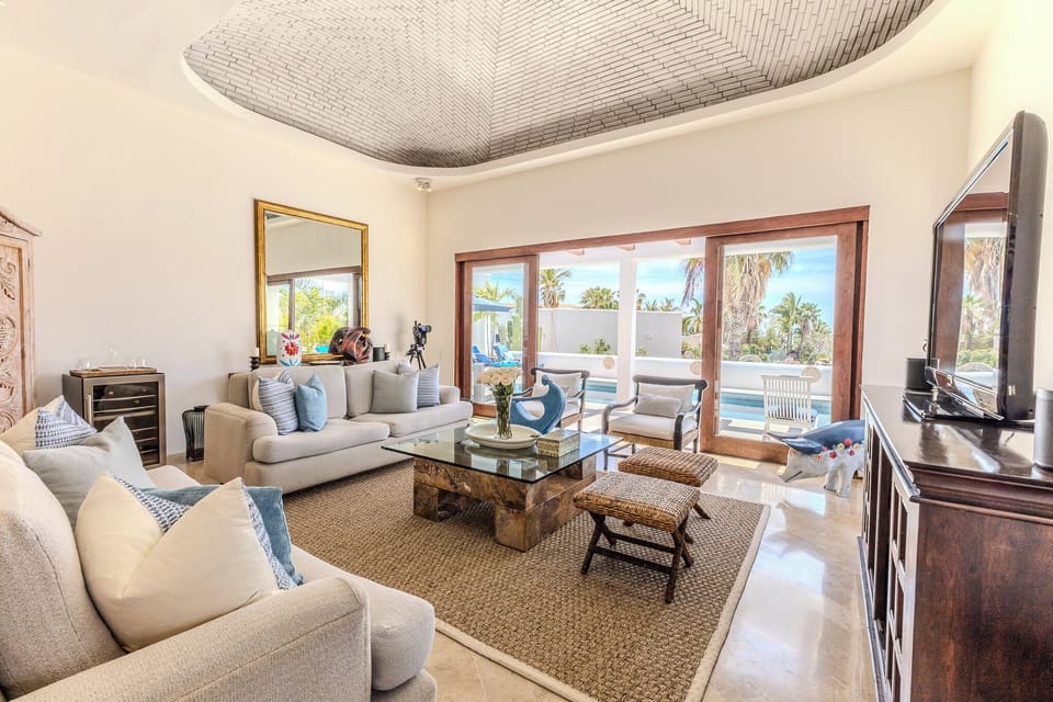Living Room with Marble Flooring, Domed Ceilings. Looks out to pool and ocean.